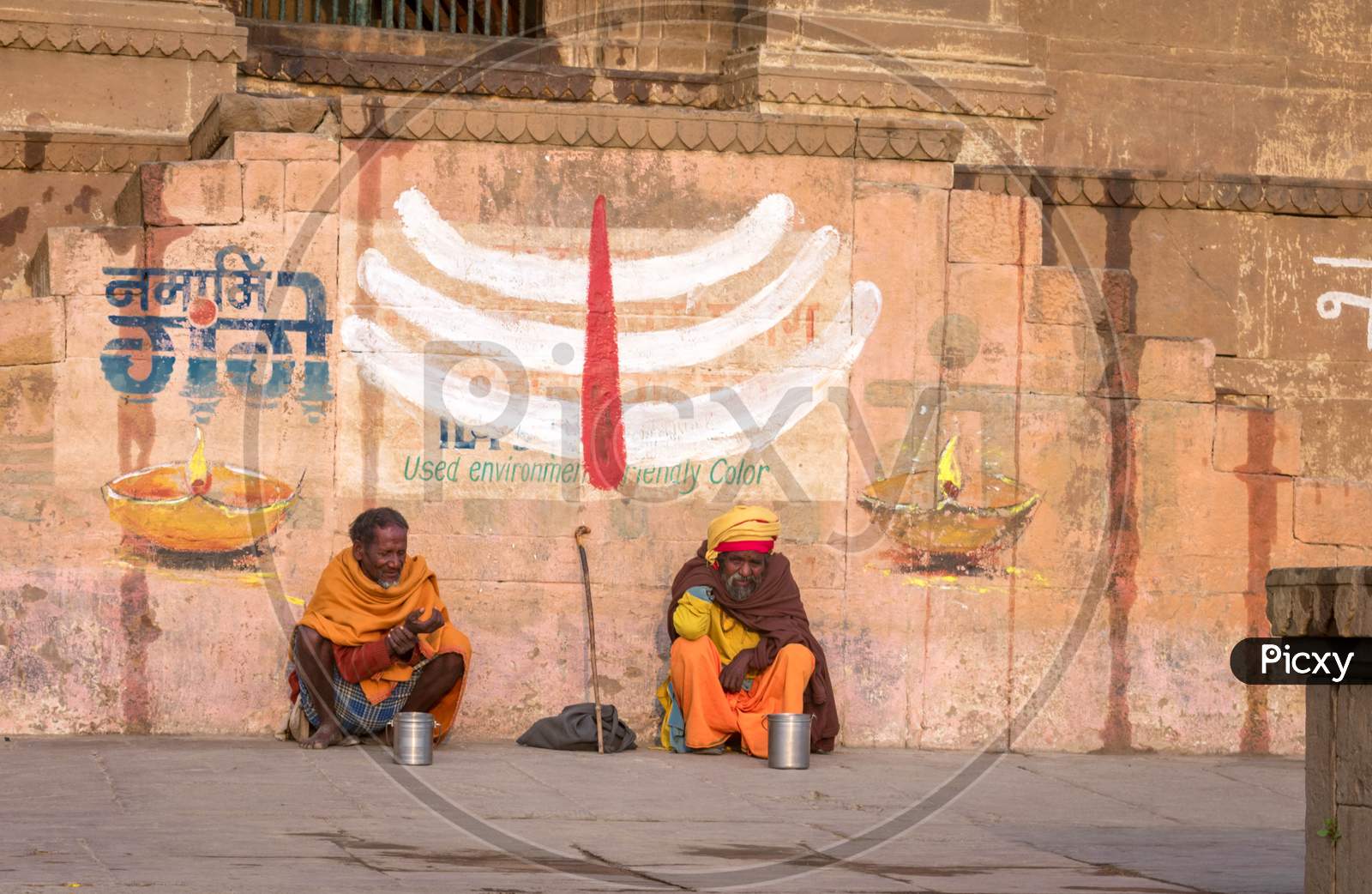Two sadhu sitting at varanasi ghat.