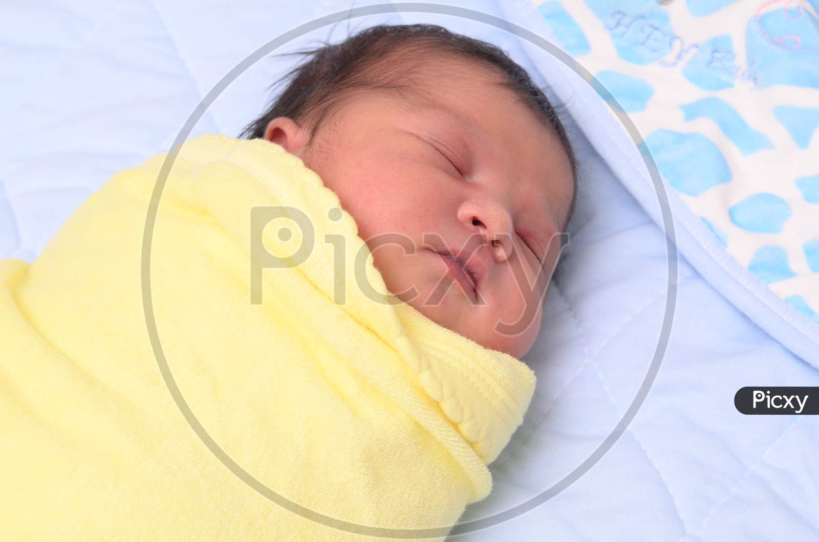 The Sleeping Newborn Girl Or Boy Lies On The Bad