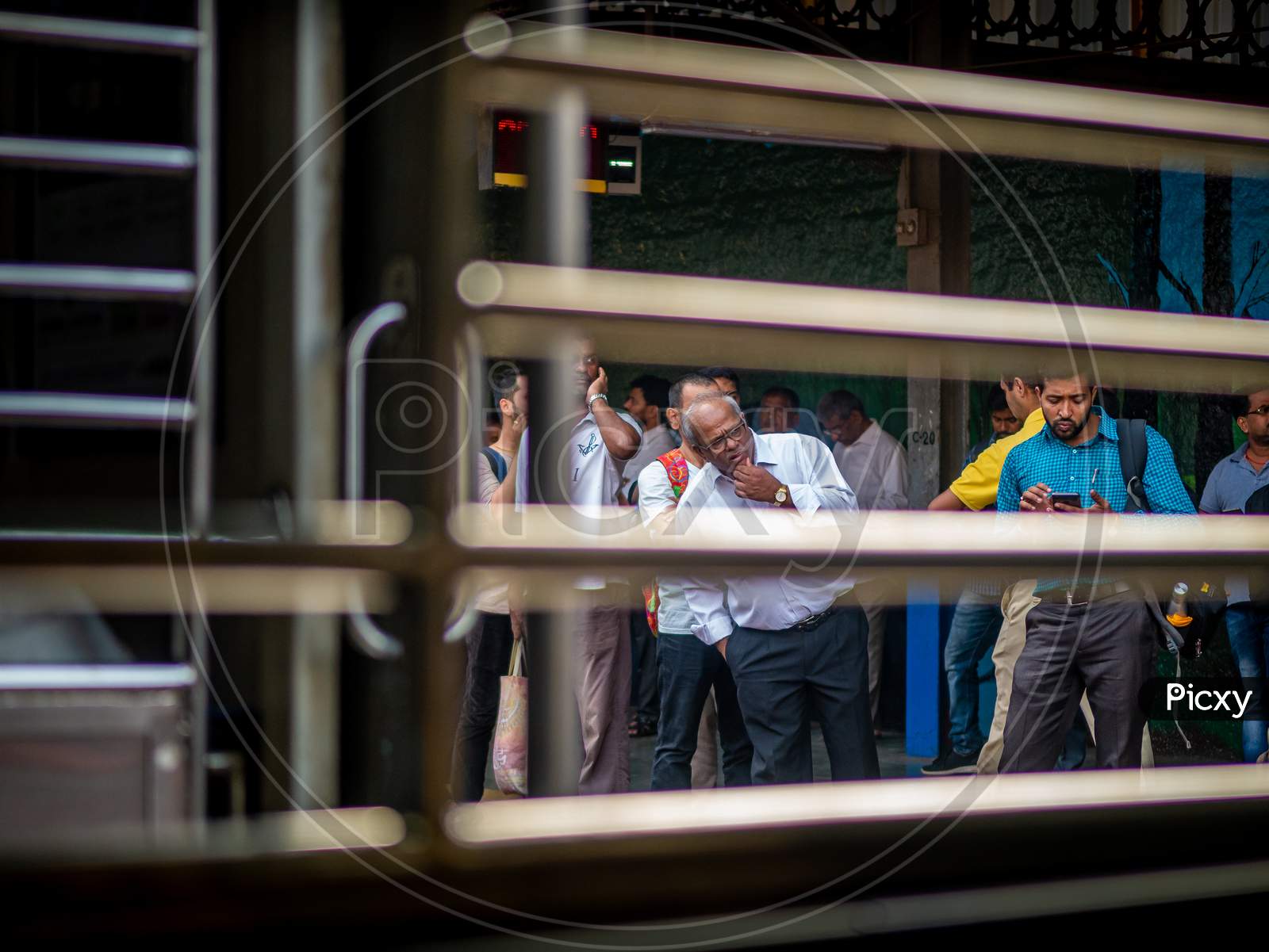 Unidentified Passengers Waiting At Railway Station For Mumbai Local Train