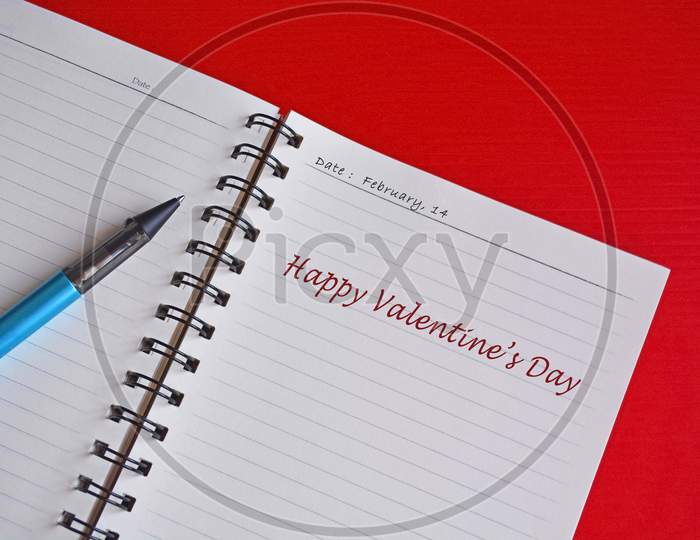 Text On White Notepad With Red Background. Top View And Valentine'S Day Concept.