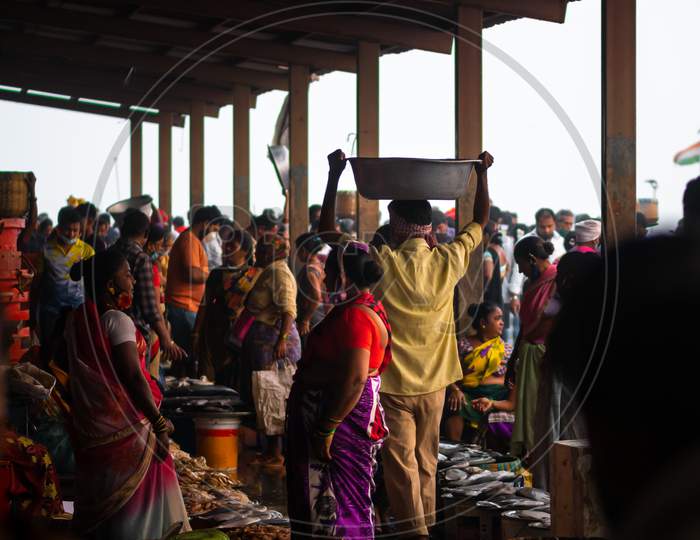 Unidentified Women And Men Trade In A Wide Variety Of Fish At One Of The Oldest Fish Market In Mumbai Called Bhaucha Dhakka