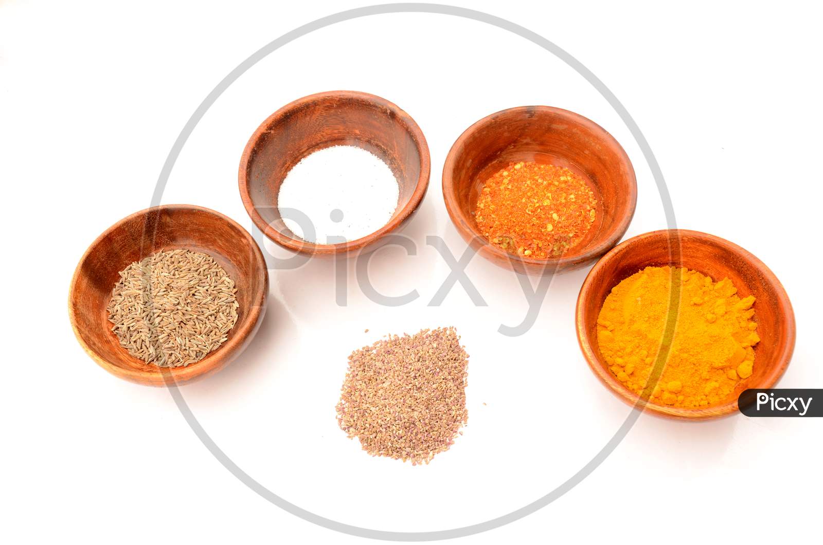 Decorative With Wooden Bowl In The Salt,Cuisine,Cumin,Chilly Powder, Turmeric, On The White Background.