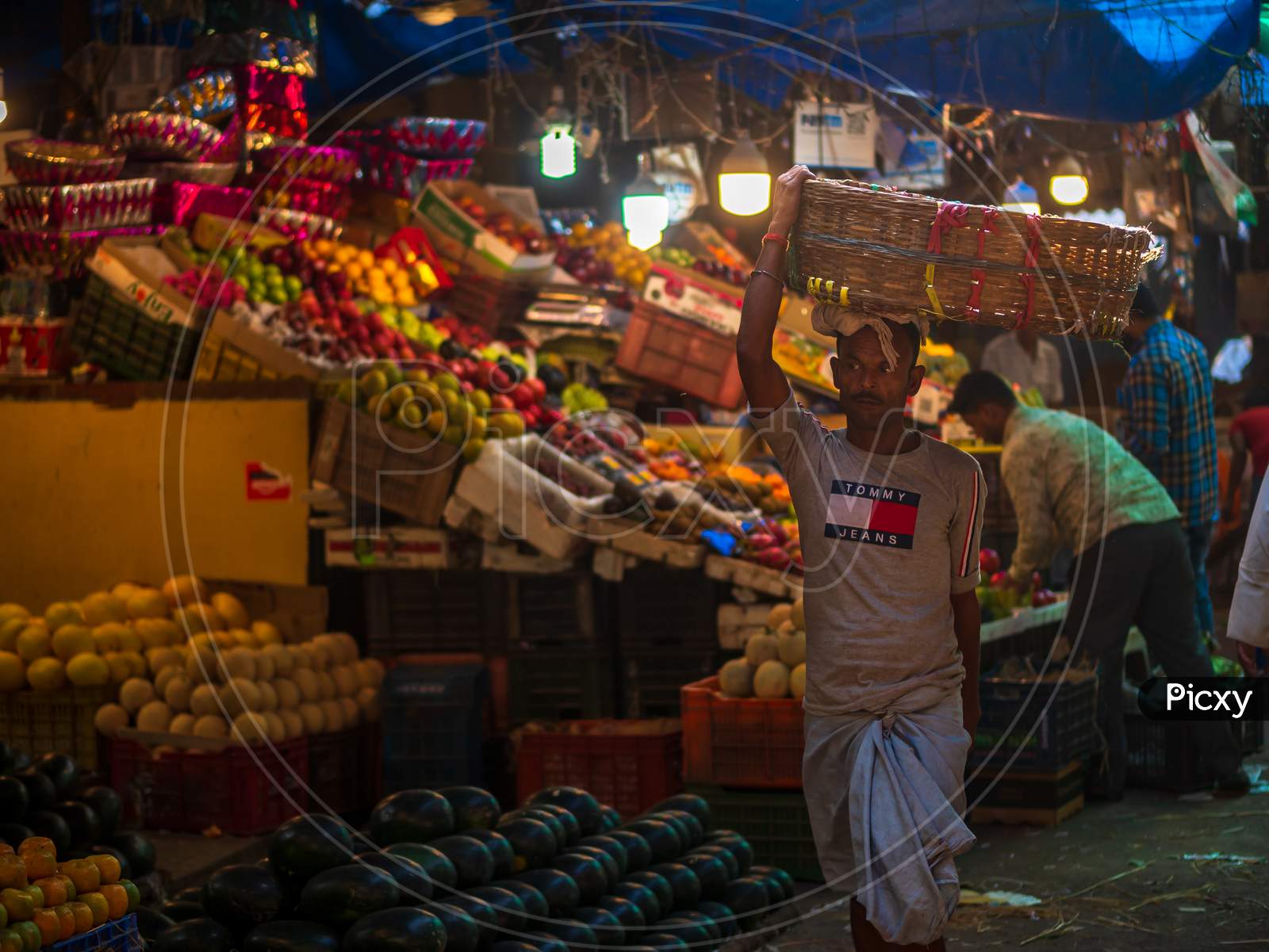 A Porter Carrying Empty Cart In Fruit Market In South Mumbai