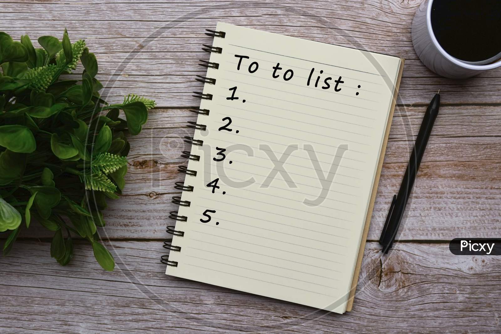 To Do List Text On Notepad On Wooden Desk