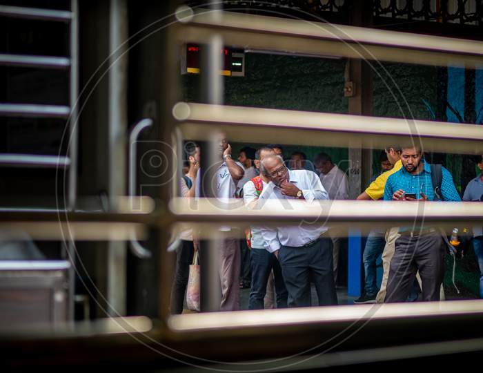 Unidentified Passengers Waiting At Railway Station For Mumbai Local Train