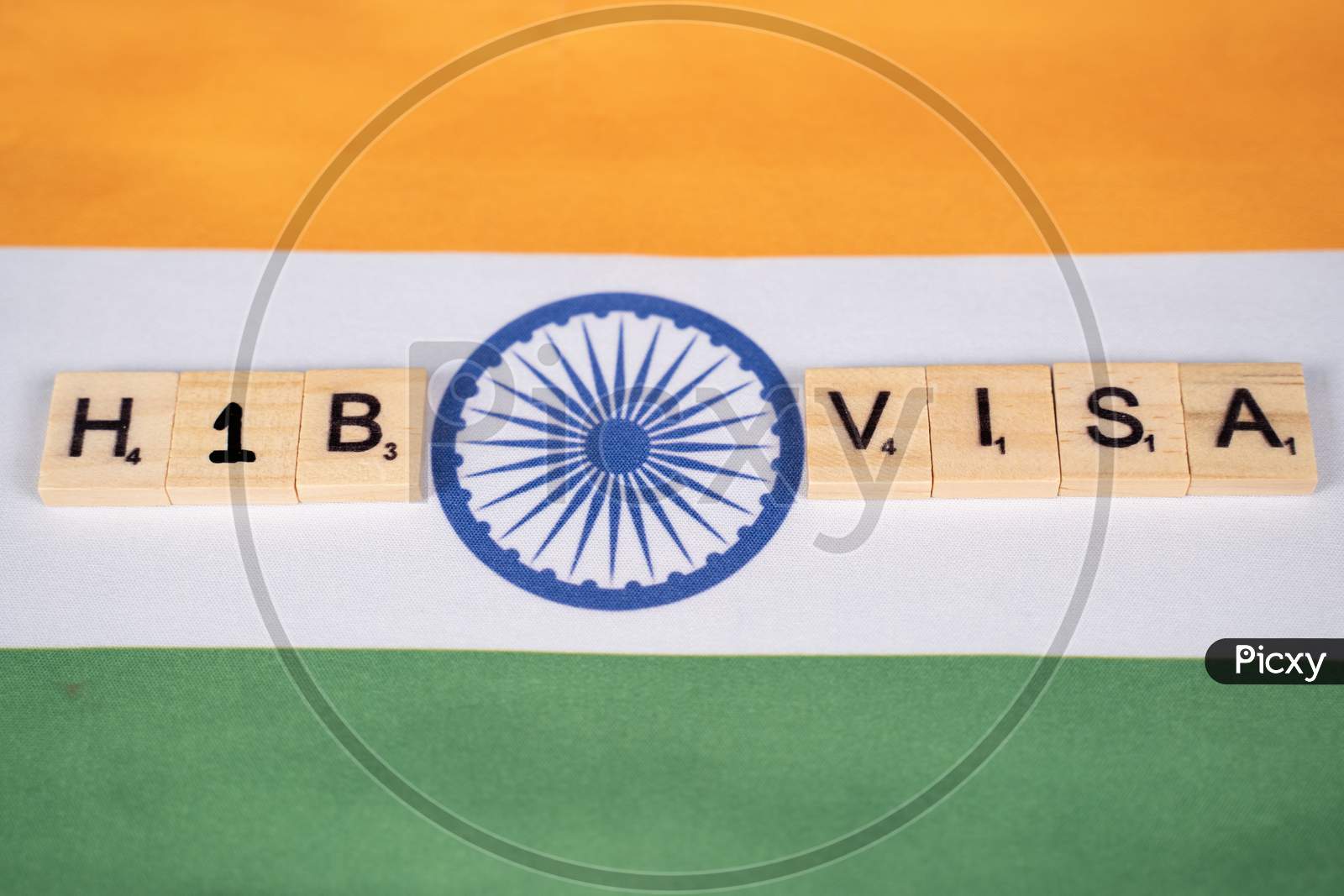 Maski, India 11,March 2021 : H1B Visa Scribble Tiles On Indian Flag