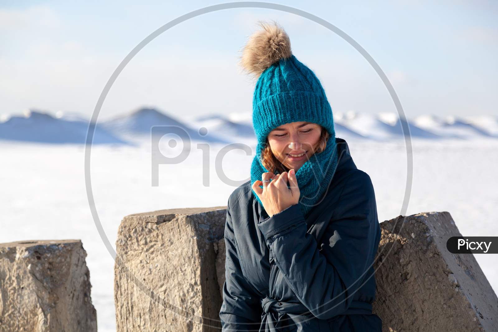 Fashion Lifestyle Portrait Of Young Trendy Woman Dressed In Warm Stylish Clothes  Laughing And Smiling In The  Winter Mountains.  Portrait Of Joyful Woman
