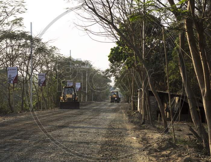 A Bulldozer Caring Road Building Material From One Place To Another. Selective Focus.