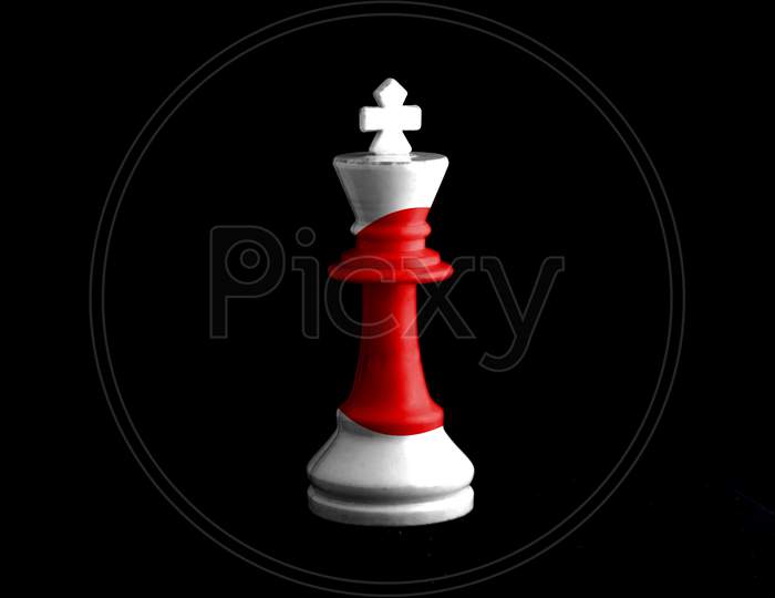 Image Of A Chess King With Japanese Flag Defeating White Chess Pieces. On Black Background.