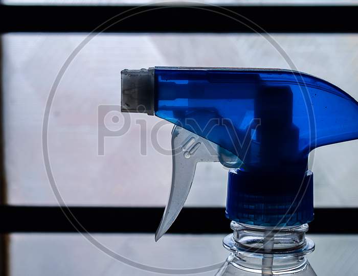 Stock Photo Of A Blue Color Trigger Pistol Spray Bottle Kept In Front Of Window Used For Cleaning Purpose At Home In Bangalore City Karnataka India