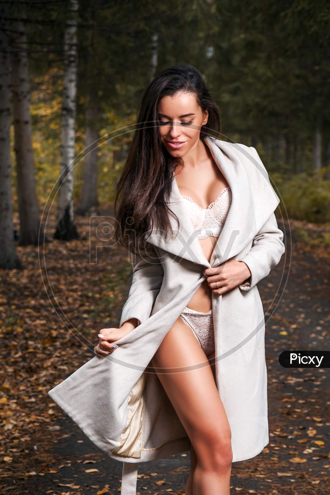Woman  Posing  In Underwear And Coat