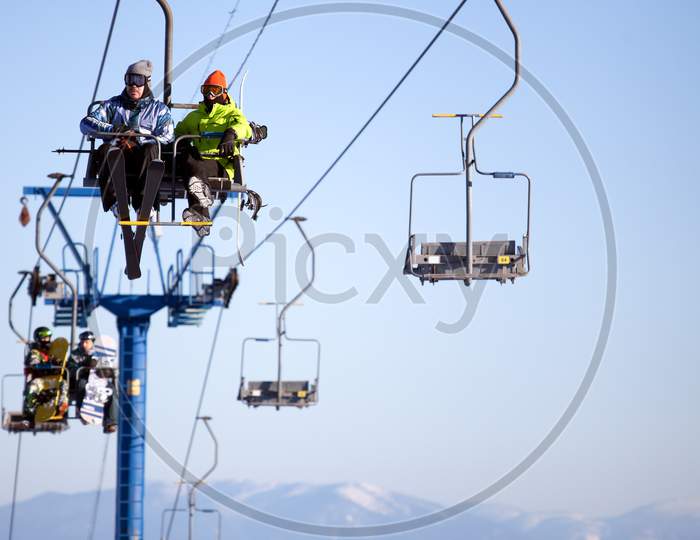 View Of The Ski Lift And Snow-Capped Mountains