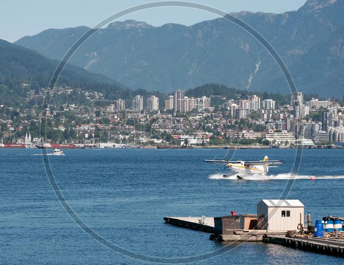 Seaplane Taxiing In Vancouver