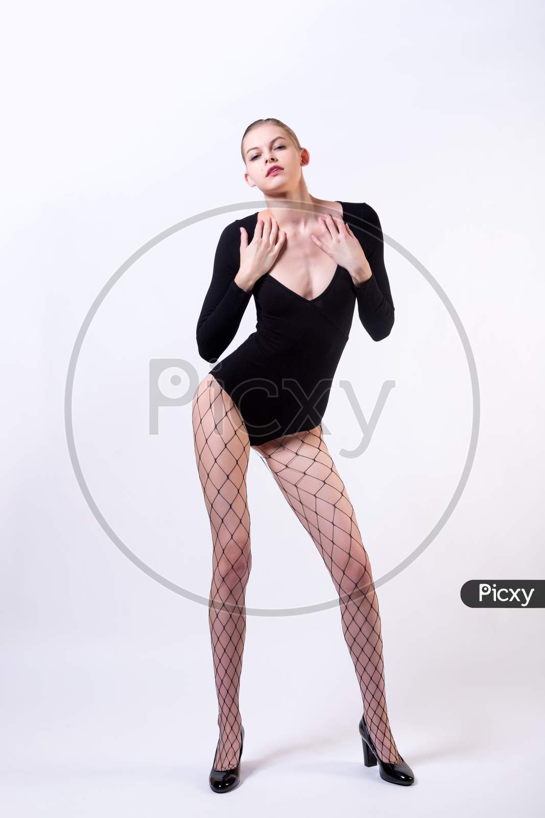 Fashion Portrait Of Woman In  Studio. High Young Model Girl In  Stylish Clothes, In Pantyhose Nets And High Heels Posing In Studio, Portrait Of Beautiful Woman, Model Posing Training