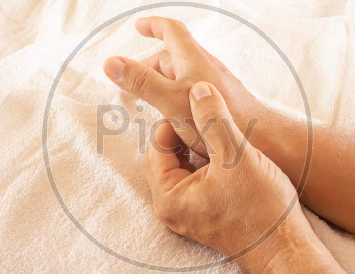 Adult Man With Pain In The Hands. Joint Pain In Young Adults. Hands Calming The Pain.