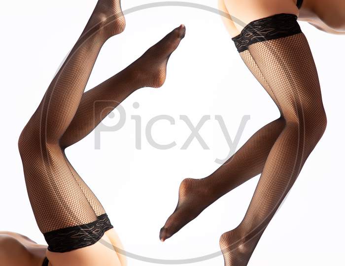 Close Up Of The Slim And Beautiful Legs In  Black Sexy Nylon Black Pantyhose. Woman In Hosiery.Concept Of Beauty Woman Posing For Legs.