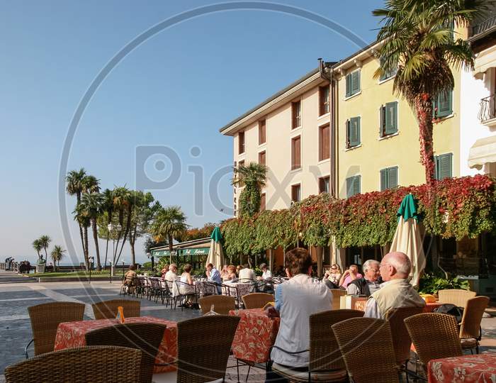 Sirmione, Lake Garda/Italy - October 27 : People Relaxing In Cafes And Restaurants In A Square In Sirmione Lake Garda On October 27, 2006. Unidentified People.