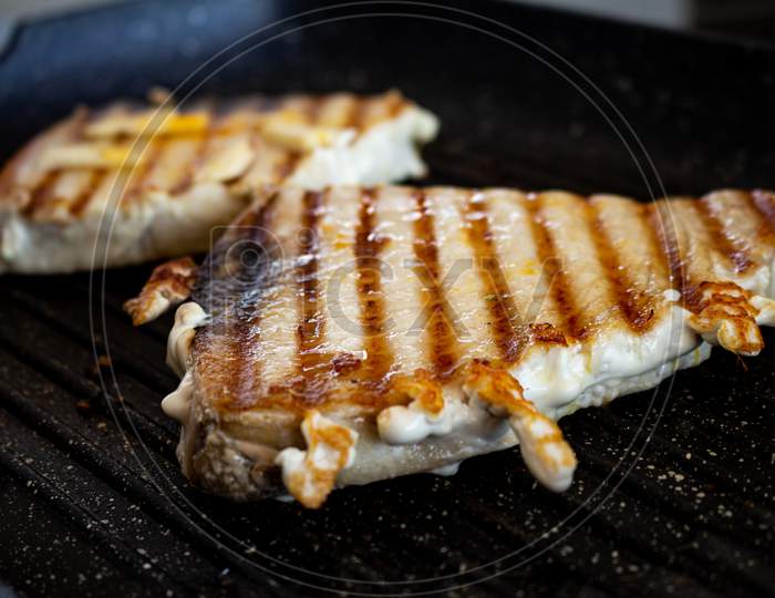 Pork Steaks Cooking On The Grill. Selective Focus. Pork Animal In Steak Seasoned With Garlic.