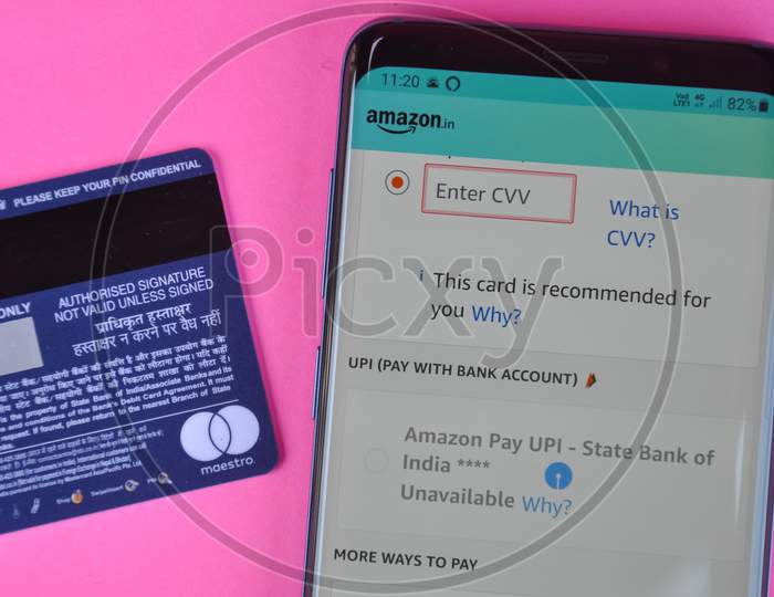 Mandi, Himachal Pradesh, India - March 05 2021: Concept of online shopping, Entering cvv code at amazon app in smartphone for shopping.
