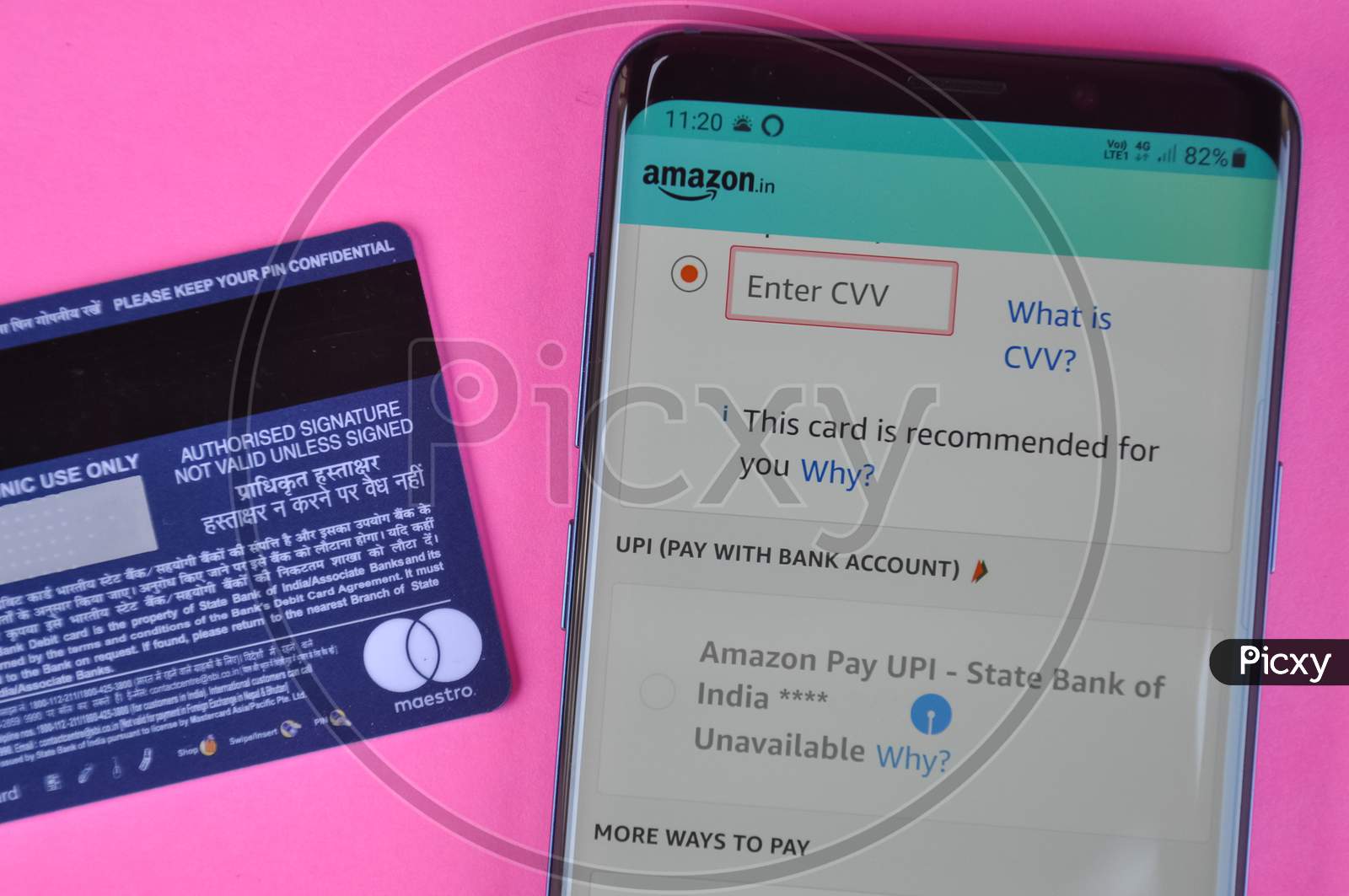 Mandi, Himachal Pradesh, India - March 05 2021: Concept of online shopping, Entering cvv code at amazon app in smartphone for shopping.