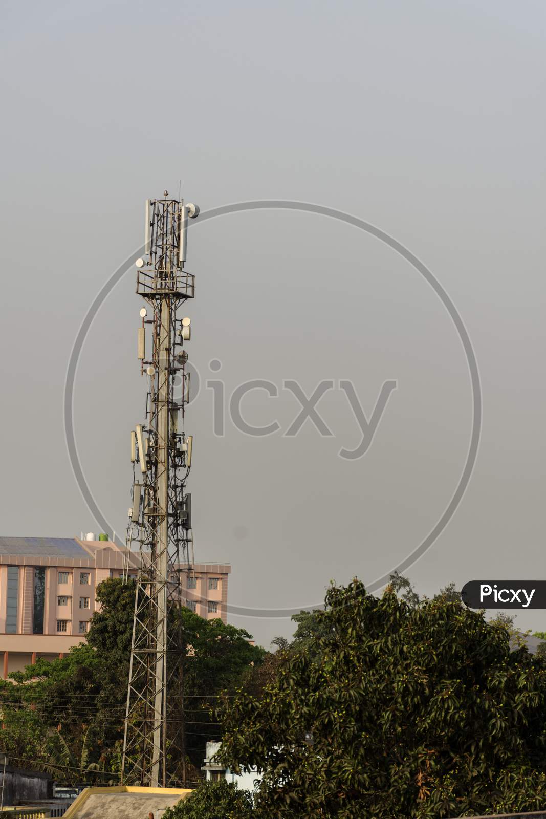 Mobile Telecommunication Tower Antenna And Satellite Dish With Sky Background.