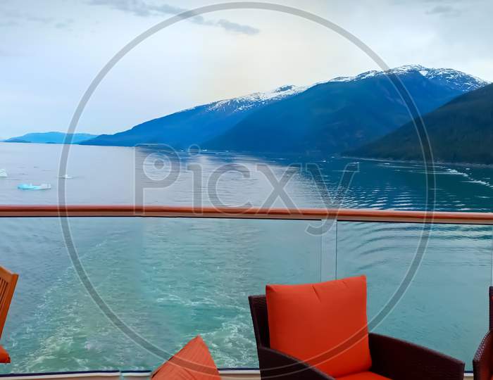 Inside Passage In Alaska For Ship. View Of Mountain And Ocean From A Cruise Ships Open Bar