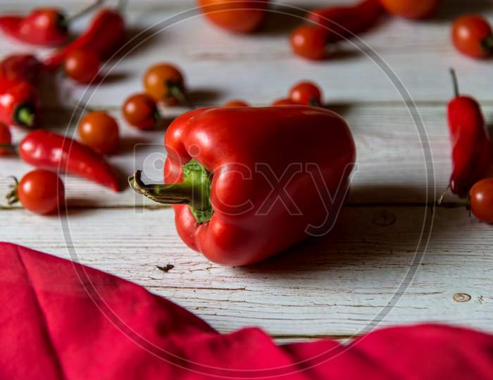 Close up of red bell pepper on a wooden background