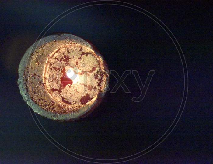 The View From The Top At The Top Of The Birning Candle With Golden Layer Ob The Red Wax