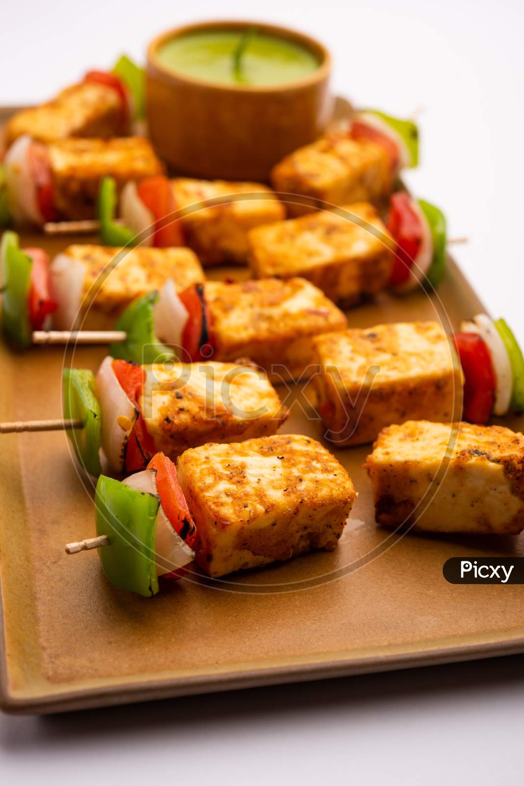 Indian Starter Snack Paneer Tikka With Spices Served With Green Chutney