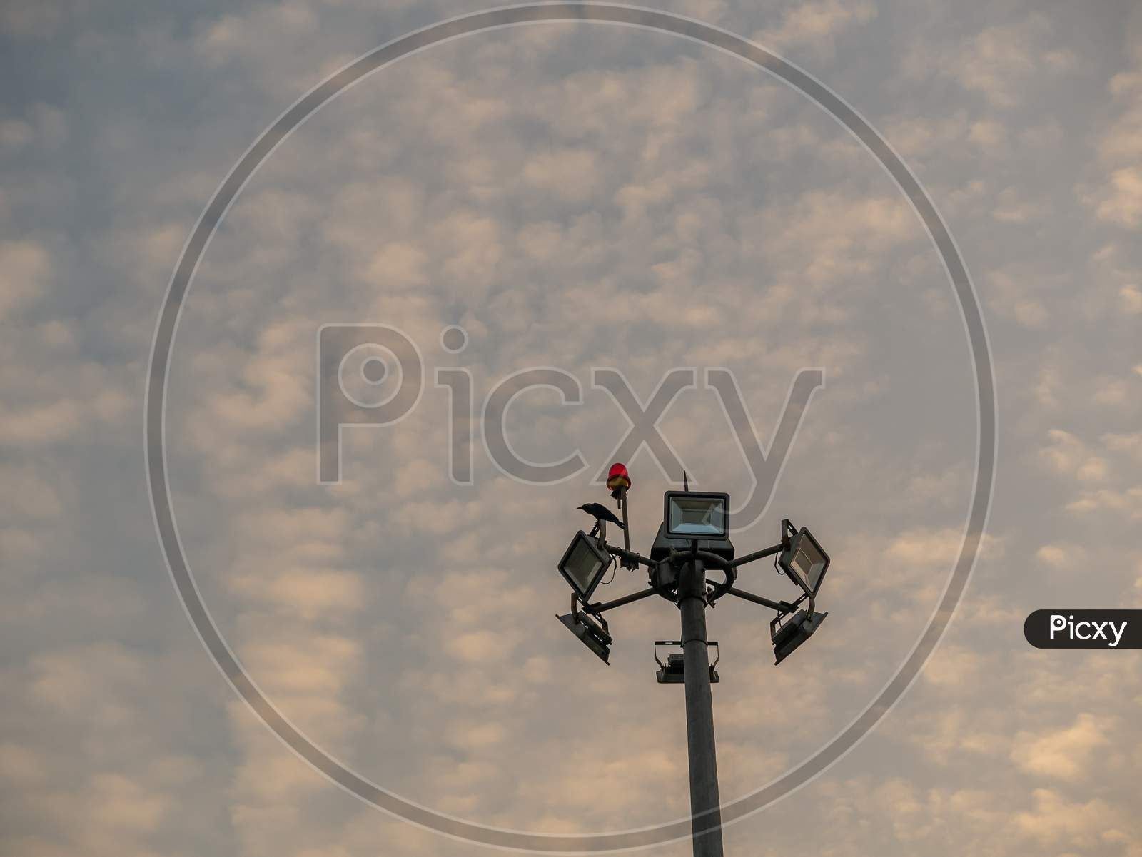 Light Pole Tower With Clouds
