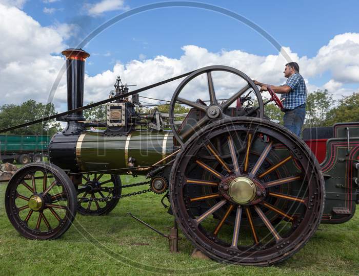 Rudgwick, Sussex/Uk - August 27 : Traction Engine At Rudgwick Steam Fair In Rudgwick Sussex On August 27, 2011. Unidentified Man.