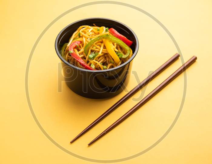 Indo Chinese Schezwan Noodles, Chicken Hakka Noodles Packed In Plastic Box For Online Food Delivery