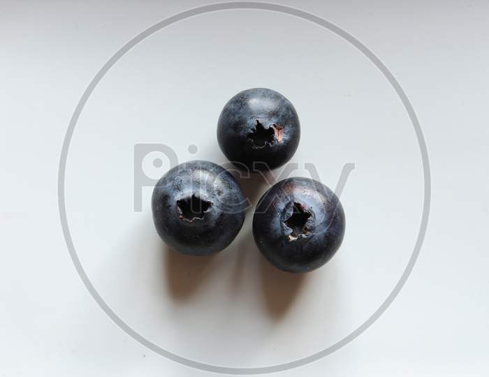 Photography Of Three Blueberries Isolated On White For Food Illustrations