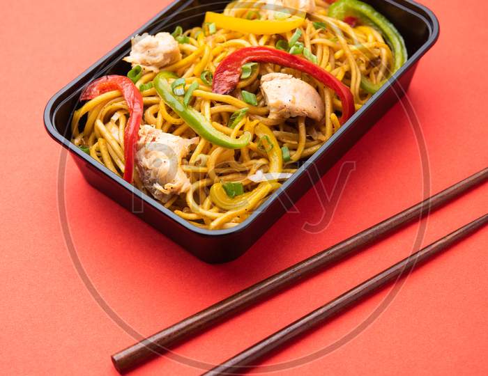 Indo Chinese Schezwan Noodles, Chicken Hakka Noodles Packed In Plastic Box For Online Food Delivery