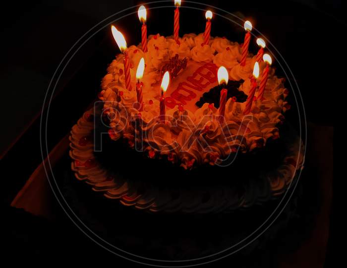 Birthday cake with candle lighe