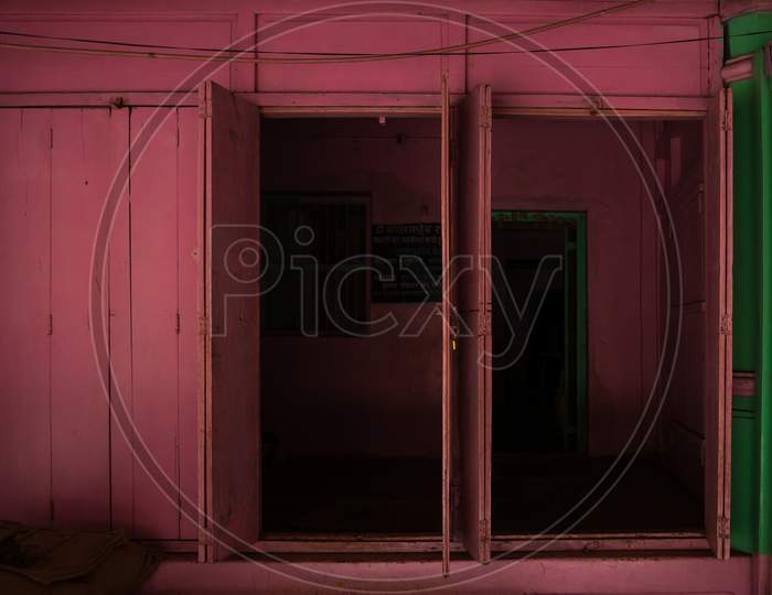 Pink Colored Vintage Wooden Shop Door At Village