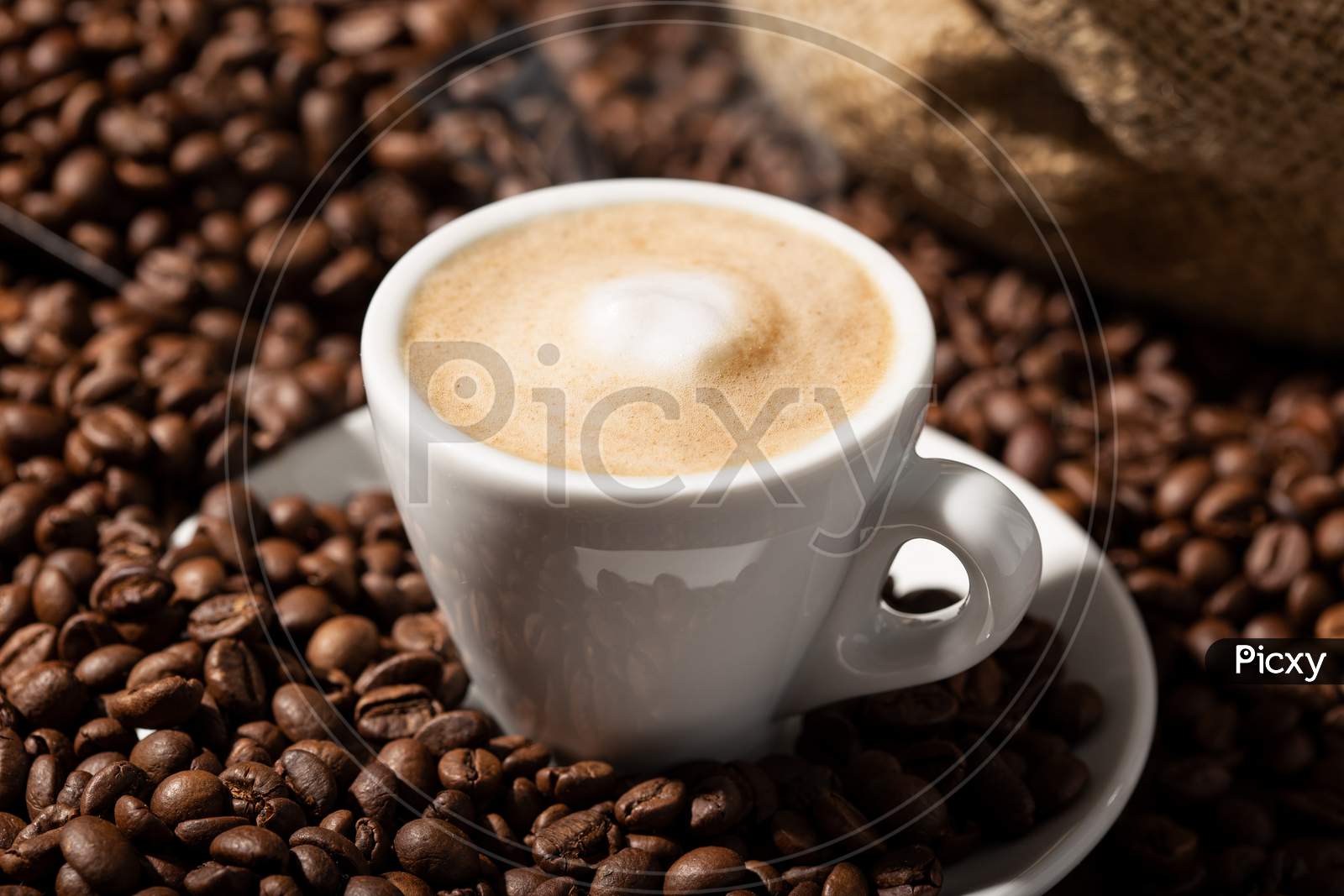 Cappuccino Or Coffee With Milk Cup And Roasted Beans