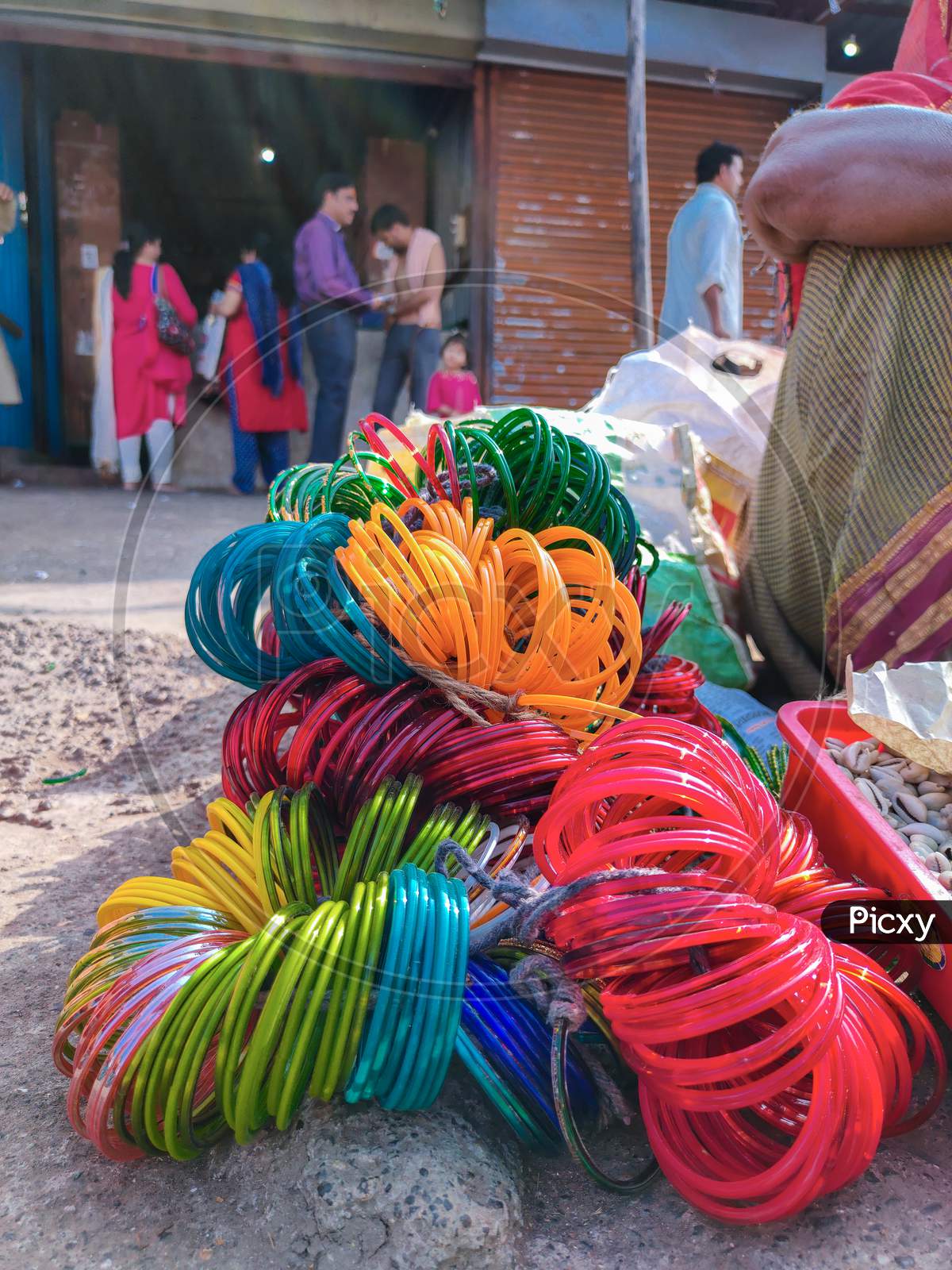Stock Photo Of Bunch Of Colorful Bangles Made Of Glass Kept On Roadside For Sale In Sunny Afternoon At Indian Market ,Focus On Glass Bangles.