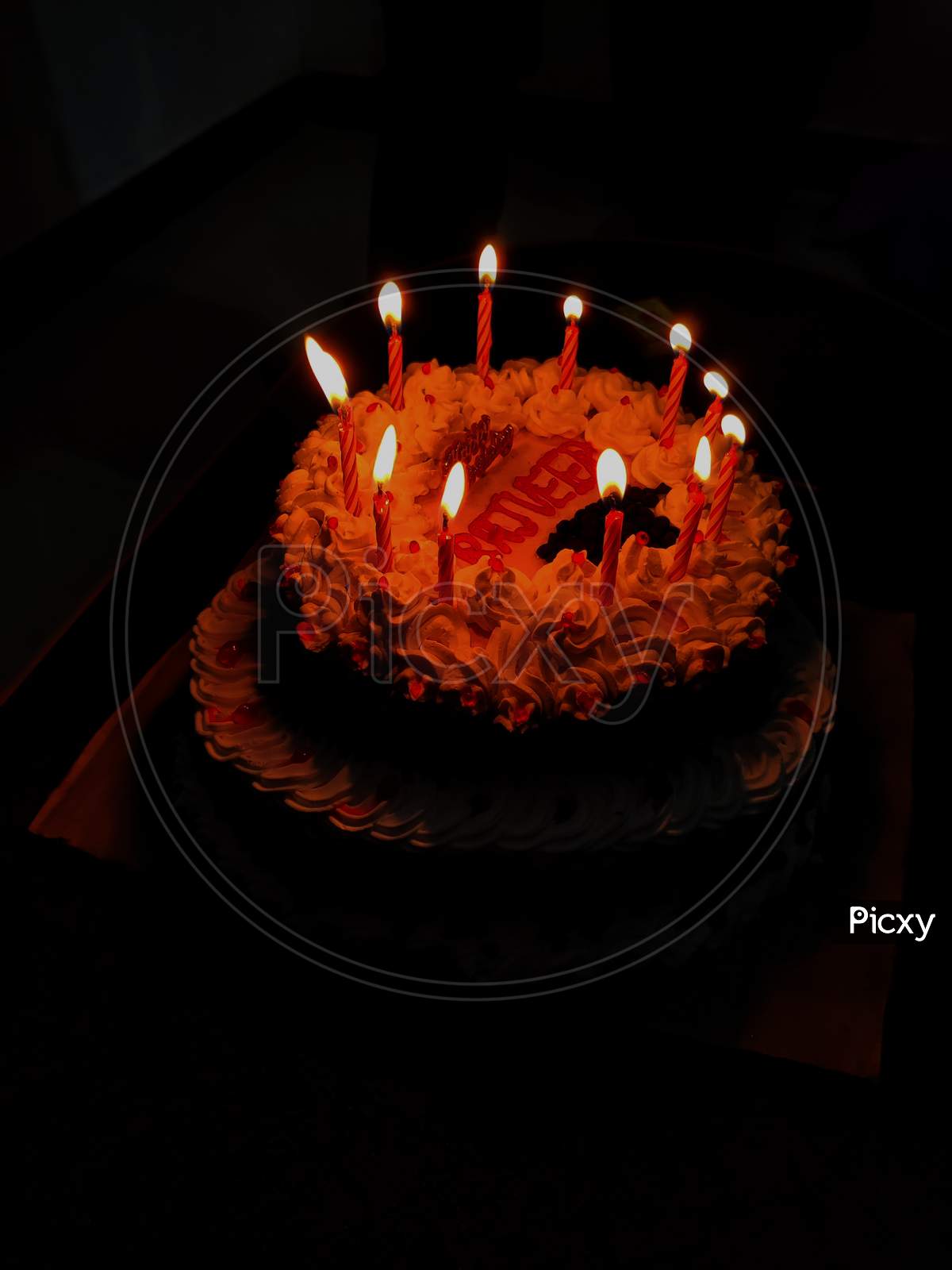 Birthday cake with candle lighe