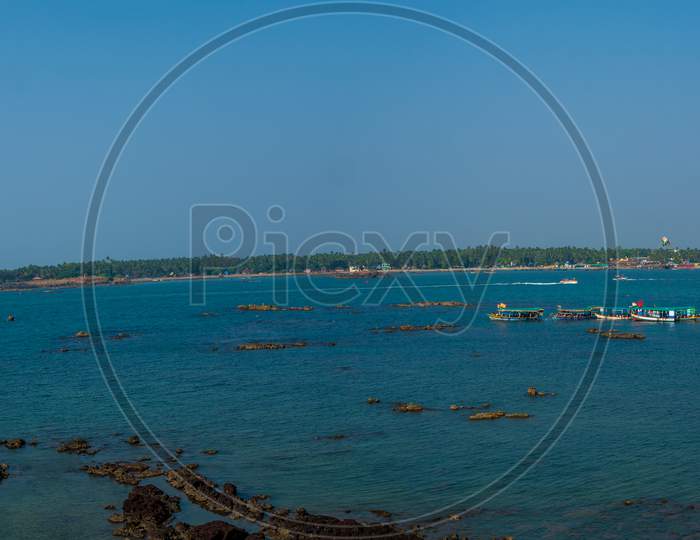Panoramic View Of Tourist Boats And Blue Sea With Beautiful Coast Of Indian Ocean, Tarkarli Beach Famous Tourist Destination