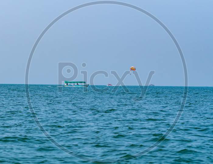 Tourist Boats And Blue Sea With Beautiful Coast Of Indian Ocean, Tarkarli Beach Famous Tourist Destination