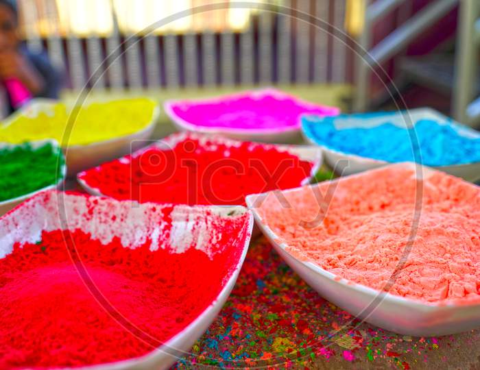 Holi color powder. Organic Gulal colours in bowl for Holi festival