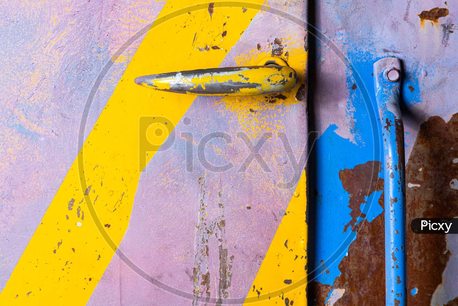 Violet Metal Wall With Yellow Diagonal Stripes, Texture Grunge Background. Geometric Colorful Door With Handle