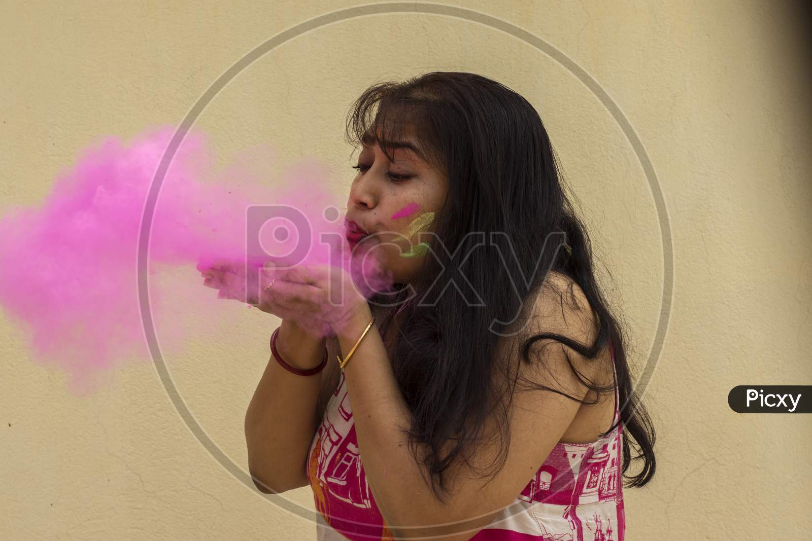 A Young Beautiful Indian Lady Playing With Holi Powder Colors.