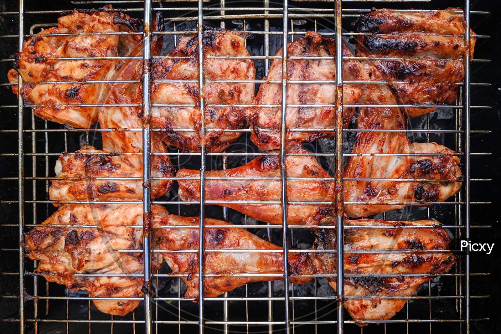 Chiken On The Grill - Paleo Food Photography.Delicious Chiken Steak, Hot Barbecue Grill.Roasted Chiken Leg Grilled, Bbq
