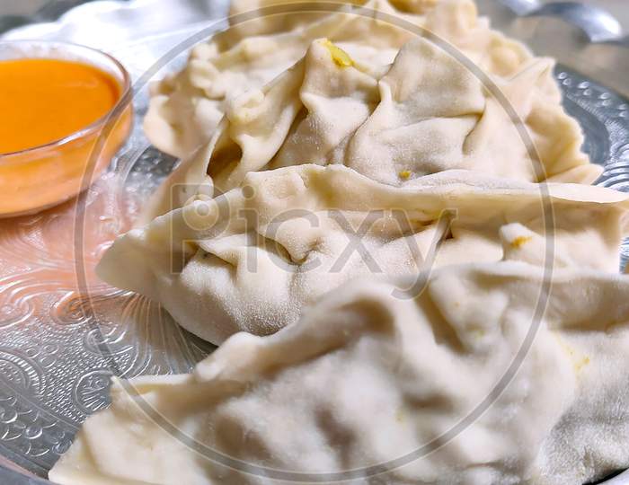 Traditional Homemade Dumpling Vegetarian Momos Food Served With Tomato Chutney Over Moody, Plate Of Traditional Nepali Food