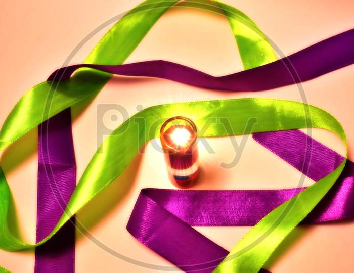 Candle and ribbon with background