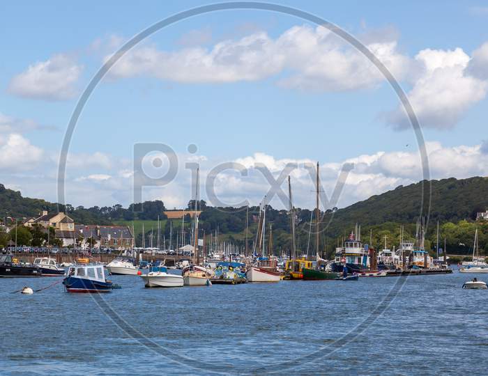 Dartmouth, Devon/Uk - July 28 : View Of Various Boats Moored On The River Dart In Dartmouth Devon On July 28, 2012. Unidentified People