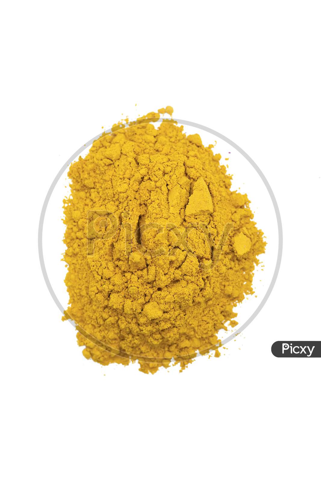 Piles Of Yellow Color Powder For Indian Holi Festival On White Background.
