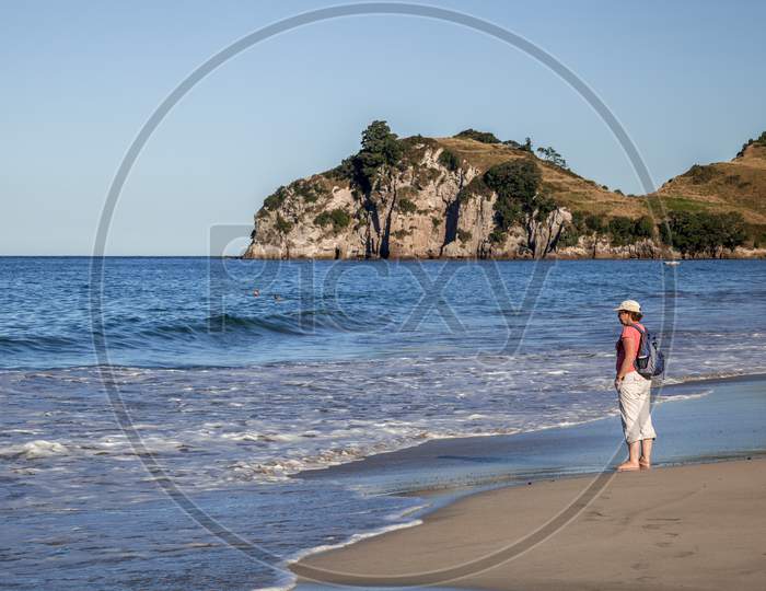 Hahei, New Zealand - February 8 : A Summer Evening At Hahei Beach In New Zealand On February 8, 2012. Three Unidentified People